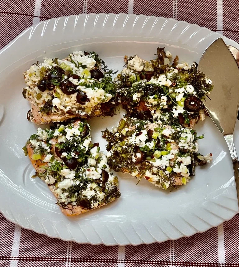 Baked Salmon on a plate with two spoons