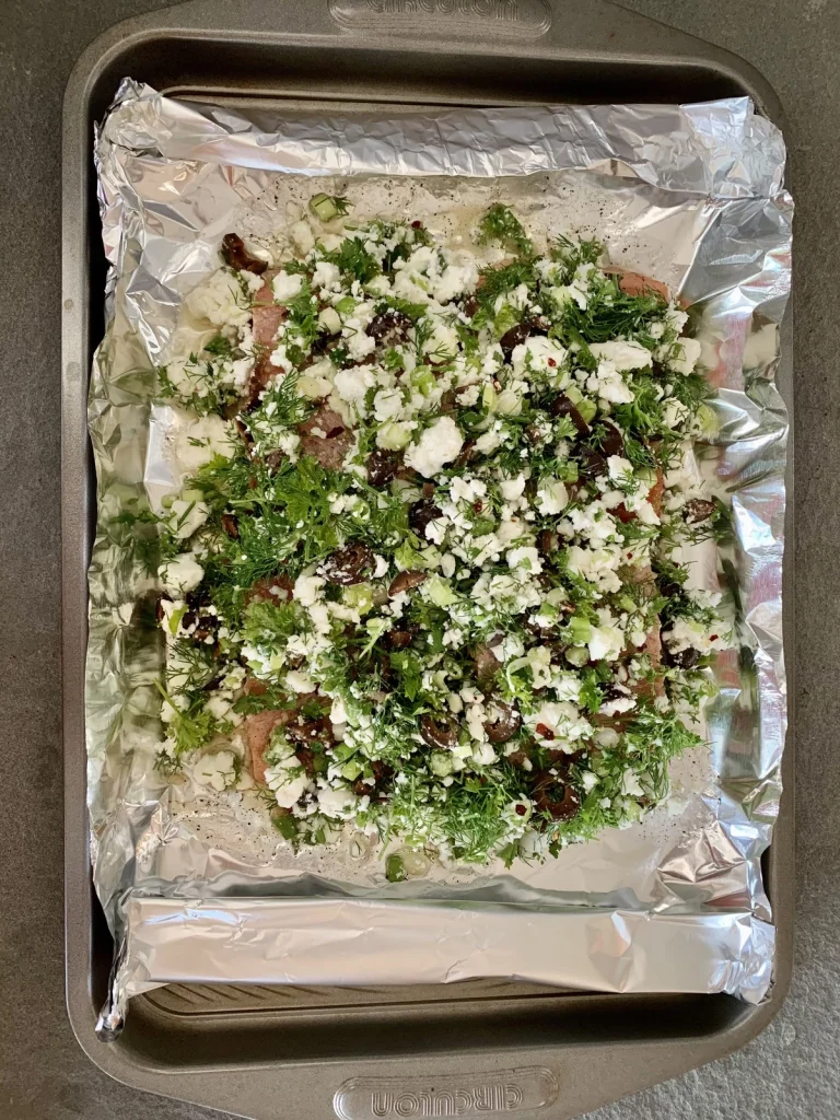 Baked Salmon in Foil garnished placed on a tray